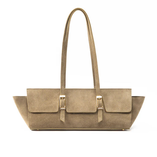 A taupe-brown suede tote bag with long shoulder straps and gold-tone buckle hardware, shown against a plain white background.