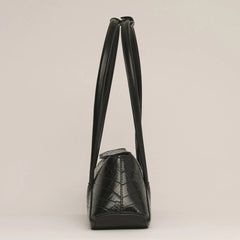 Black cylindrical keychain with a skull logo on a white background