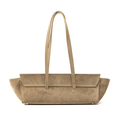 A taupe suede tote bag with long shoulder straps and a structured, wide body, shown against a plain white background.